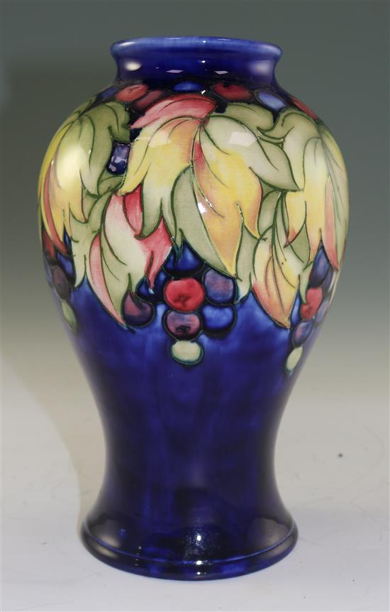 A Moorcroft leaf and berry pattern baluster vase, mid 20th century, 23.5cm (9.25in.)